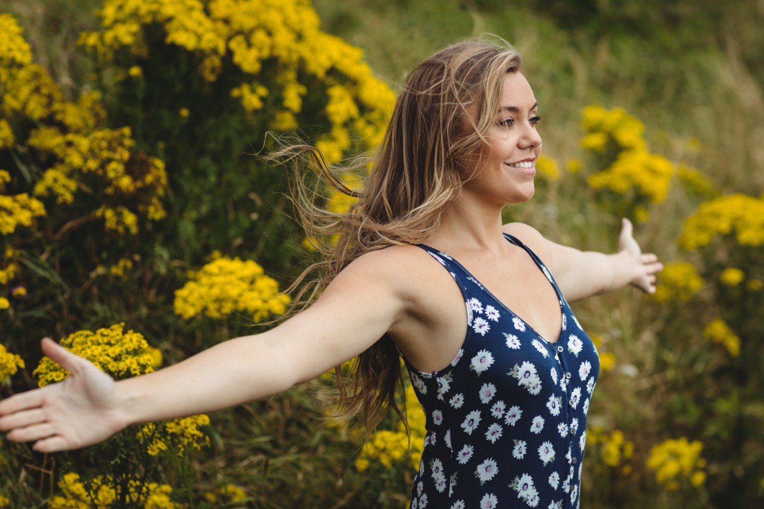 Woman Standing With Arms Outstretched Meadow - Boosting Immunity Naturally