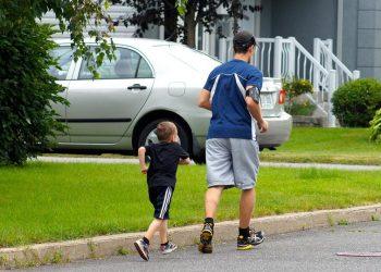 man and kid jogging outdoors enjoying healthy living benefits