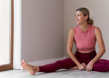 Woman doing yoga to reset metabolism after 40