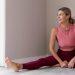 Woman doing yoga to reset metabolism after 40