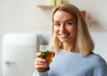 Woman enjoying herbal tea to lose weight drinking tea