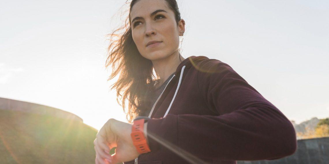 Woman jogging at sunrise to reset metabolism after 40