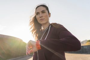 Woman jogging at sunrise to reset metabolism after 40