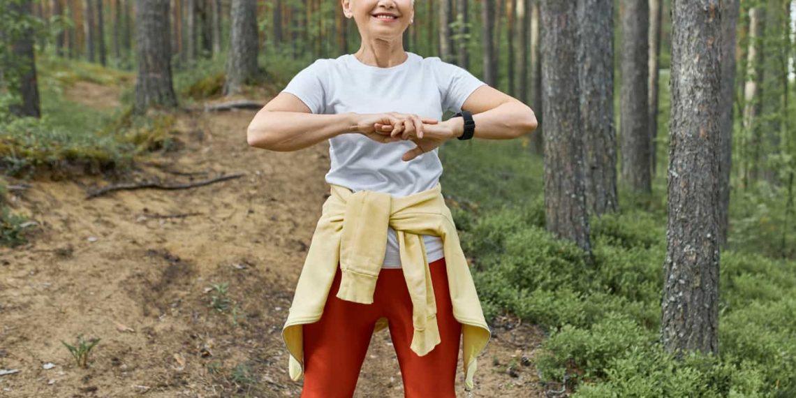 Woman walking through nature trail promoting a healthy lifestyle at any age