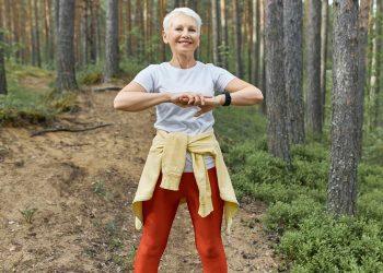 Woman walking through nature trail promoting a healthy lifestyle at any age