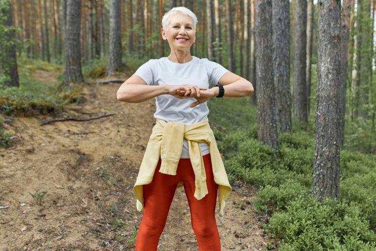 Woman walking through nature trail promoting a healthy lifestyle at any age