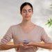 person meditating with calm expression using natural remedies for tinnitus