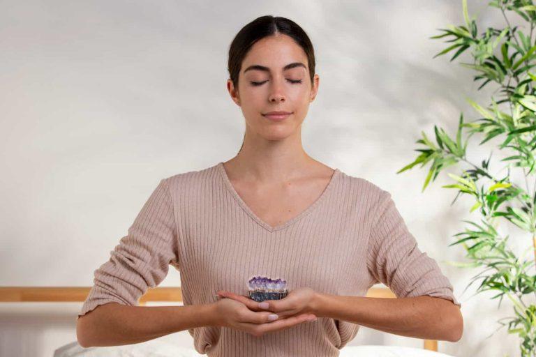 person meditating with calm expression using natural remedies for tinnitus