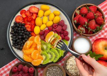 A colorful bowl of functional foods including berries, nuts, and leafy greens that support energy, focus, and longevity