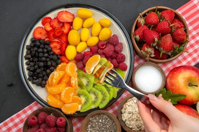 A colorful bowl of functional foods including berries, nuts, and leafy greens that support energy, focus, and longevity