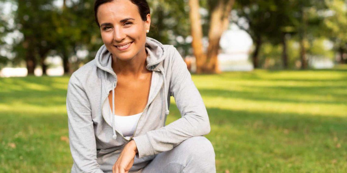 Energized woman practicing yoga with American Promise healthy living focus