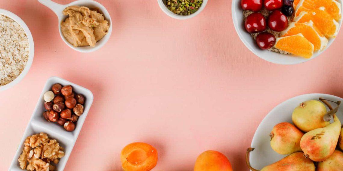 A colorful assortment of healthy snacks including fresh fruits, nuts, and vegetables representing healthy snacks for weight loss