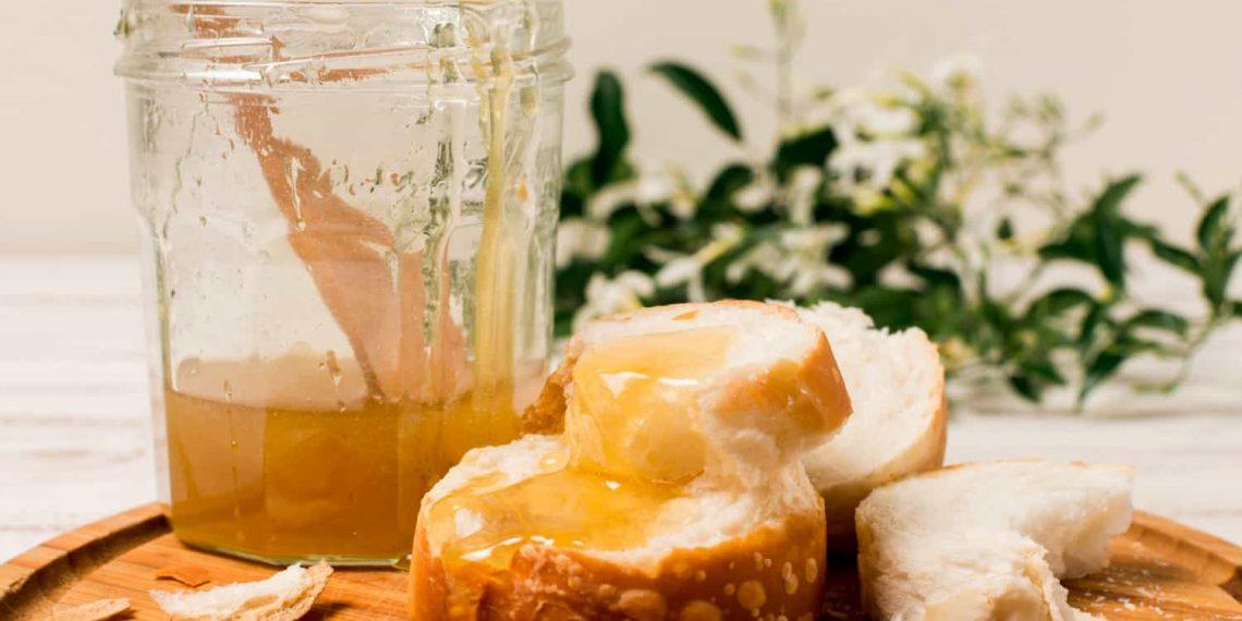 Jar of golden honey showcasing the natural health benefits of honey for immunity and skin care