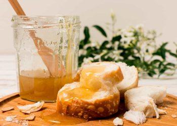 Jar of golden honey showcasing the natural health benefits of honey for immunity and skin care