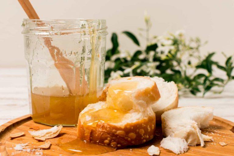 Jar of golden honey showcasing the natural health benefits of honey for immunity and skin care