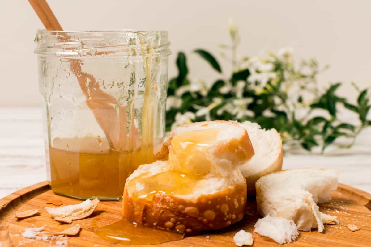 Jar of golden honey showcasing the natural health benefits of honey for immunity and skin care