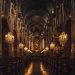 Grand cathedral interior with ornate chandeliers and detailed frescoes.