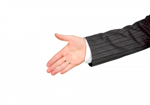 Hand extended for a handshake in business attire