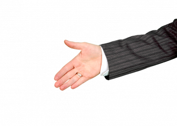 Hand extended for a handshake in business attire