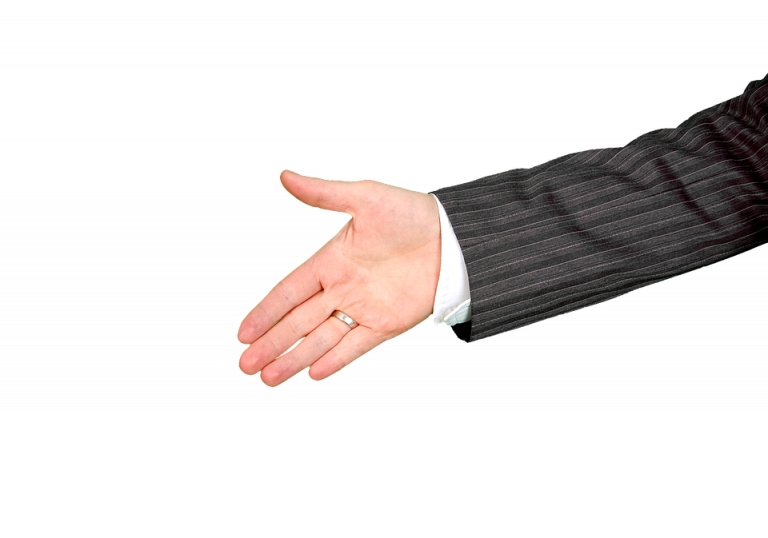 Hand extended for a handshake in business attire