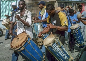 Drummers playing traditional music at a street festival.