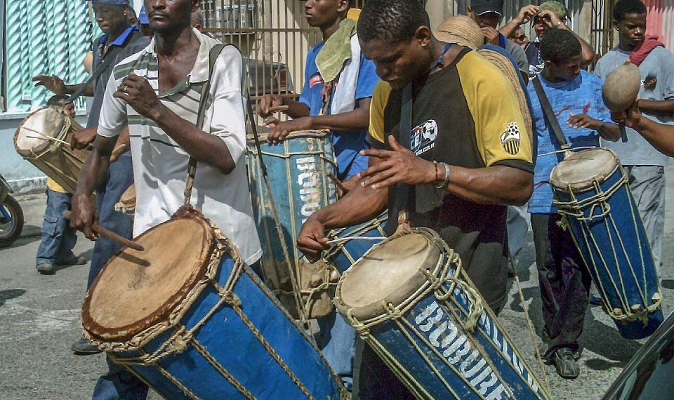 Drummers playing traditional music at a street festival.