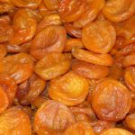 Dried apricots stacked closely together.