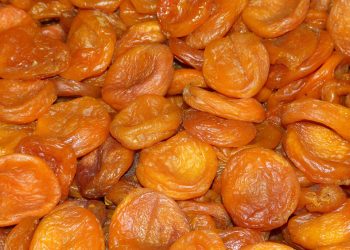 Dried apricots stacked closely together.