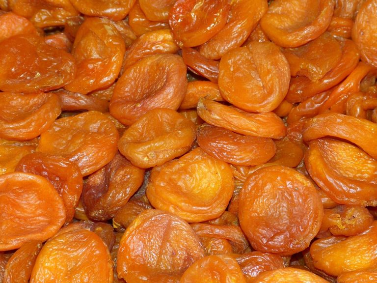 Dried apricots stacked closely together.