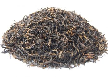 Loose leaf black tea pile showcasing rich texture.