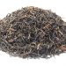 Loose leaf black tea pile showcasing rich texture.