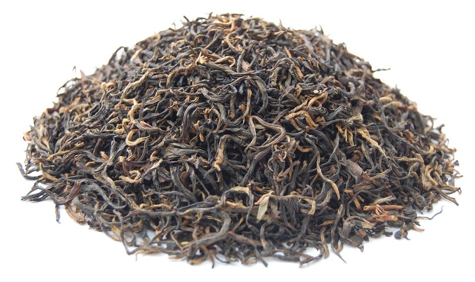 Loose leaf black tea pile showcasing rich texture.