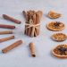 Cinnamon sticks arranged with dried orange slices and star anise.