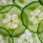 Sliced cucumber texture showcasing fresh green patterns.