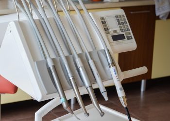 Dental tools on a control panel in a dentist office.