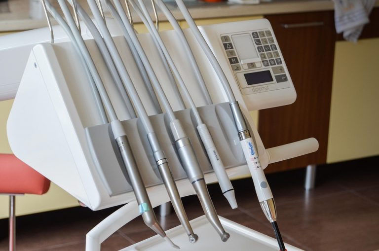 Dental tools on a control panel in a dentist office.