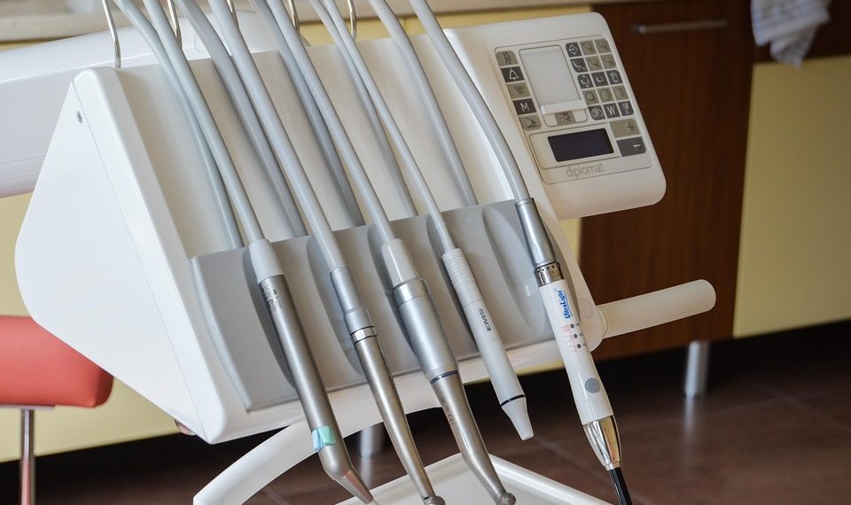 Dental tools on a control panel in a dentist office.