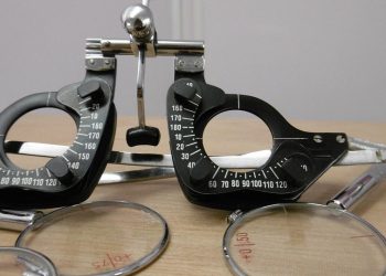 Optometrist trial frame set on office desk.
