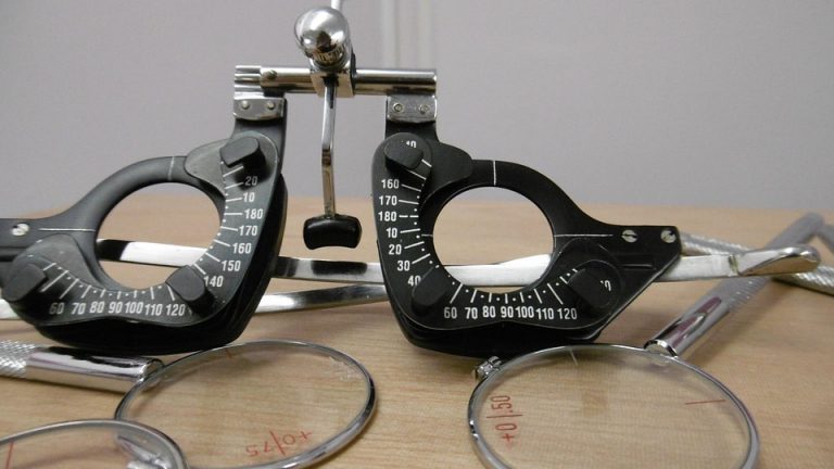Optometrist trial frame set on office desk.