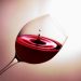 Red wine swirling in a glass, capturing elegance and rich color.