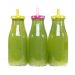 Green smoothies in polka dot capped bottles.