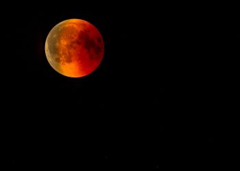 Blood Moon during total lunar eclipse in a dark night sky