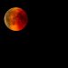 Blood Moon during total lunar eclipse in a dark night sky