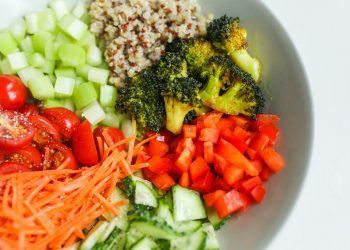 Chopped vegetables and quinoa salad in a bowl for a healthy meal.