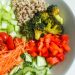 Chopped vegetables and quinoa salad in a bowl for a healthy meal.
