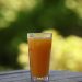 Refreshing orange juice on outdoor table.