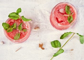 Refreshing watermelon mint drinks with ice cubes.