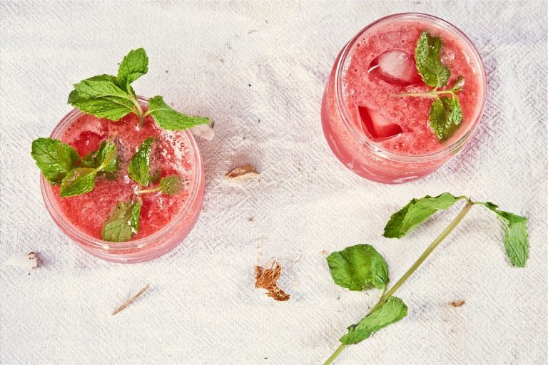 Refreshing watermelon mint drinks with ice cubes.