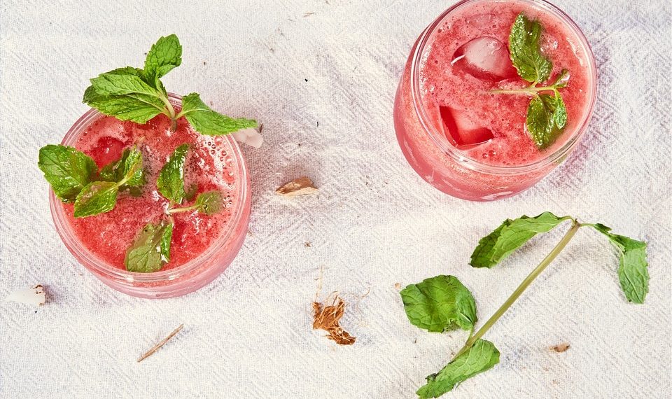 Refreshing watermelon mint drinks with ice cubes.
