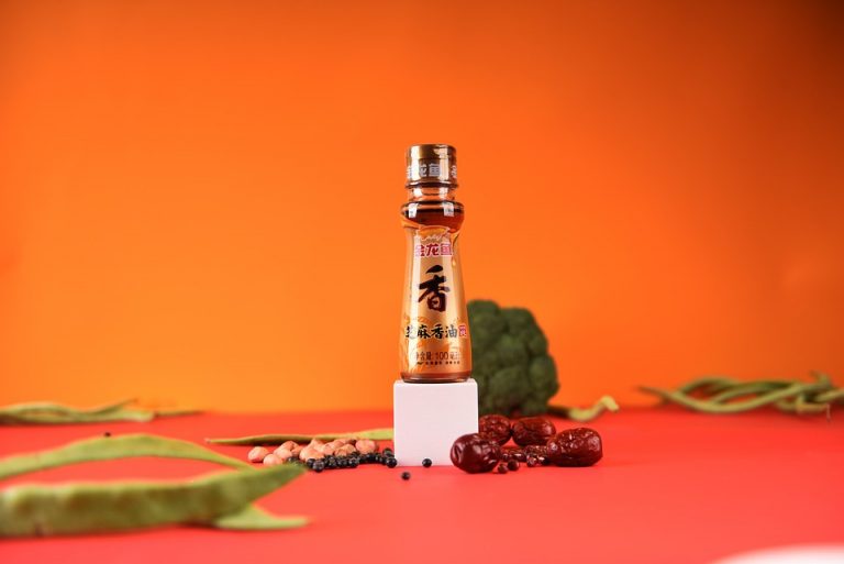 Soy sauce bottle with ingredients on bright background.